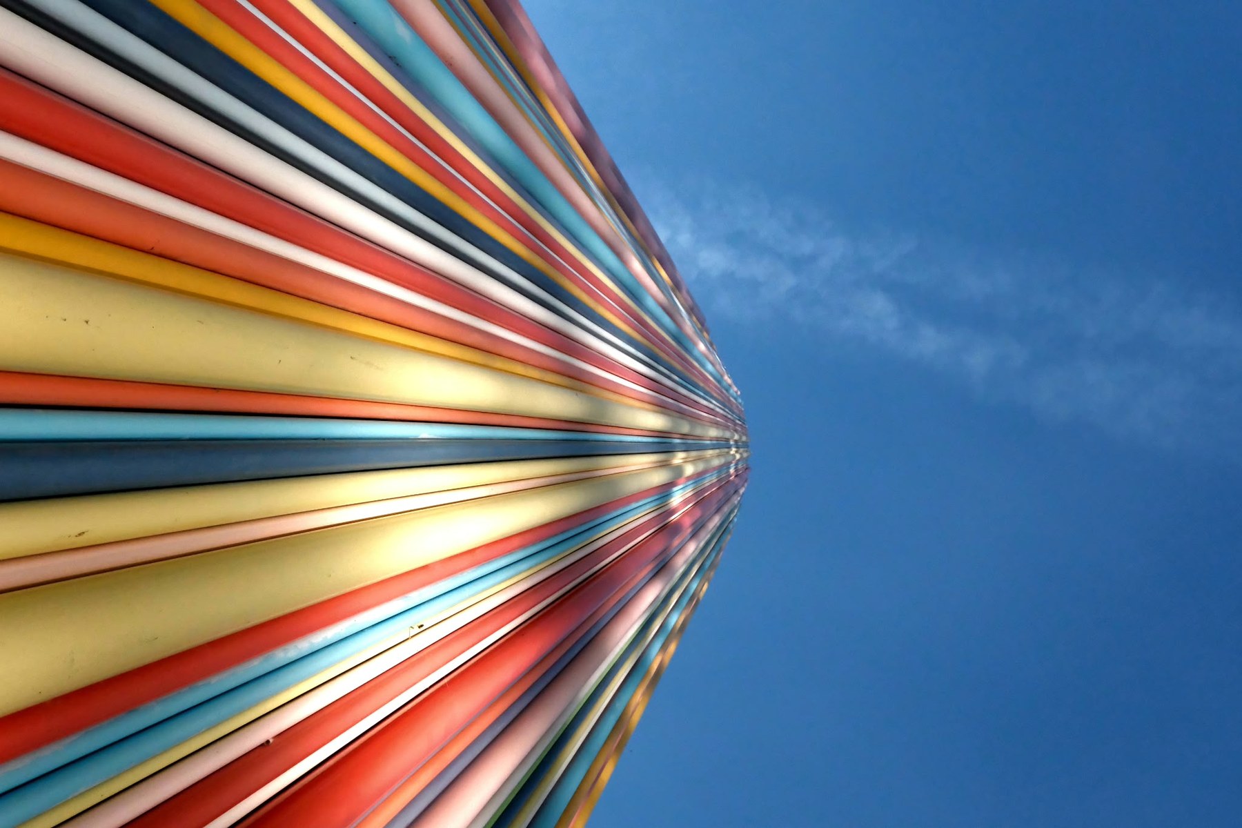 The same coloured tubes seen along their length, running to a point