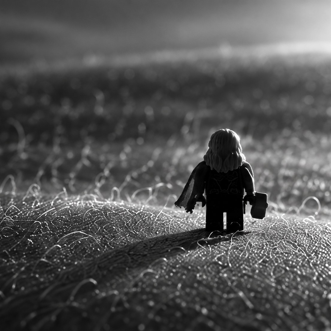 The figure crosses a field of skin where hairs stand like grass